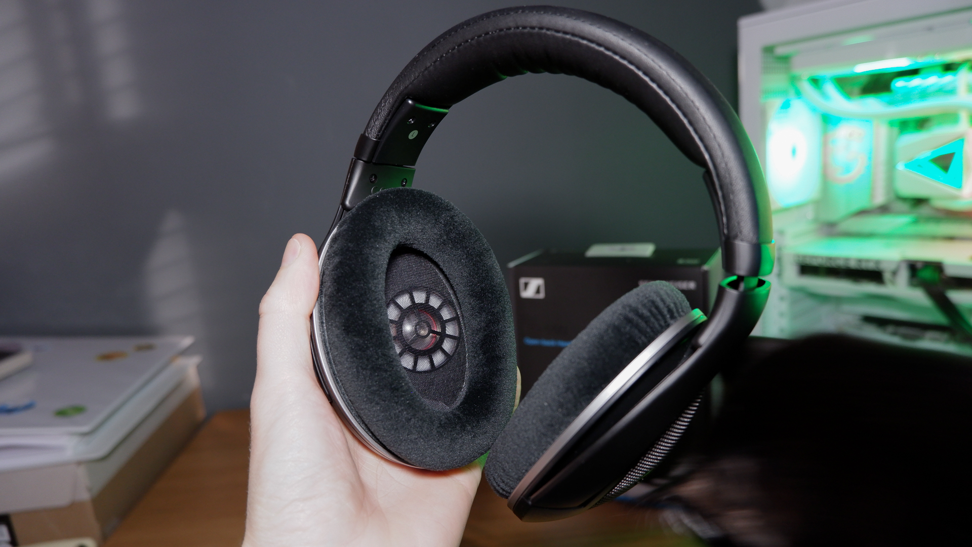 A pair of Sennheiser HD 550 headphones sat in front of its packaging.