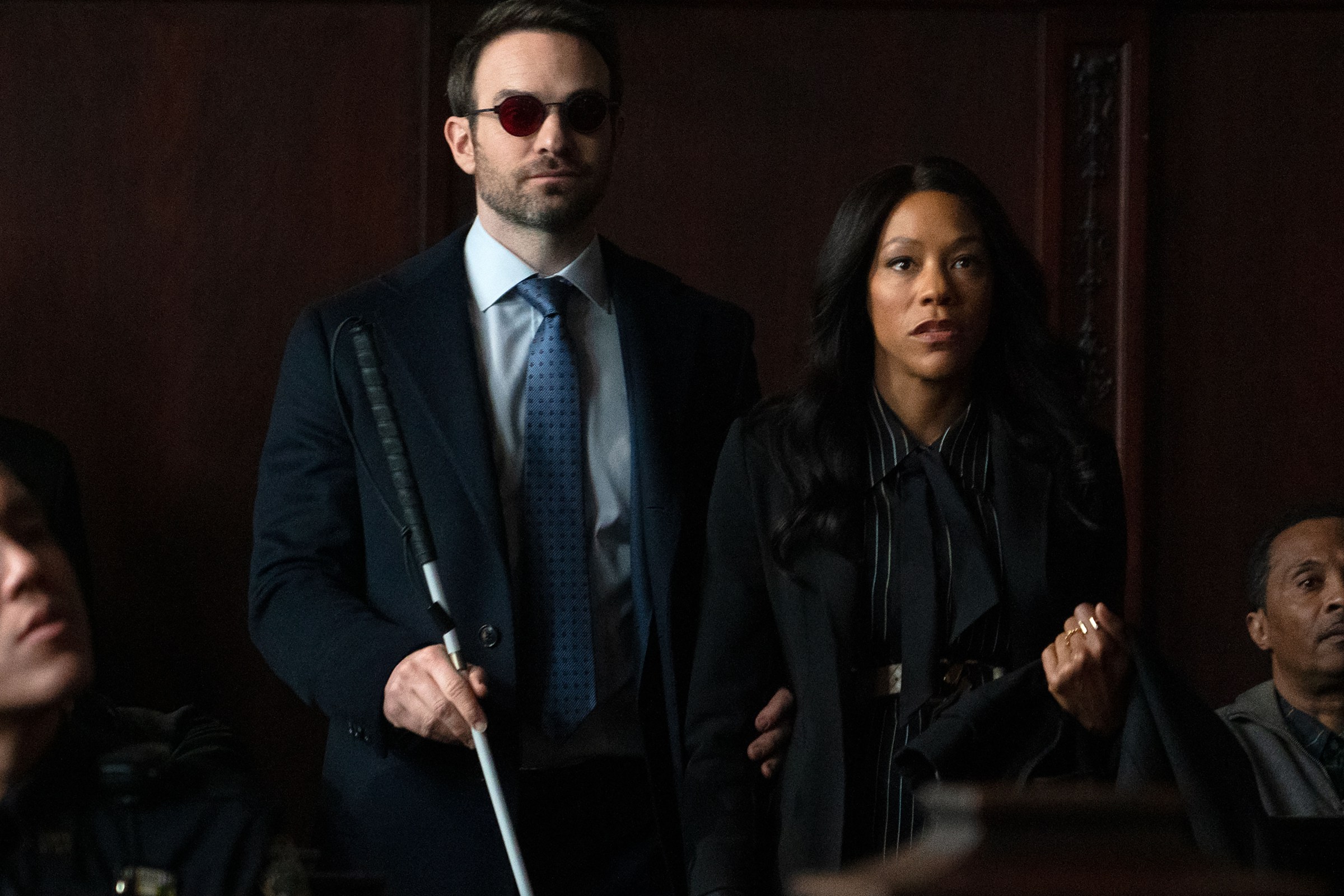 Matt standing next to Kirsten in court. From Dardevil: Born Again