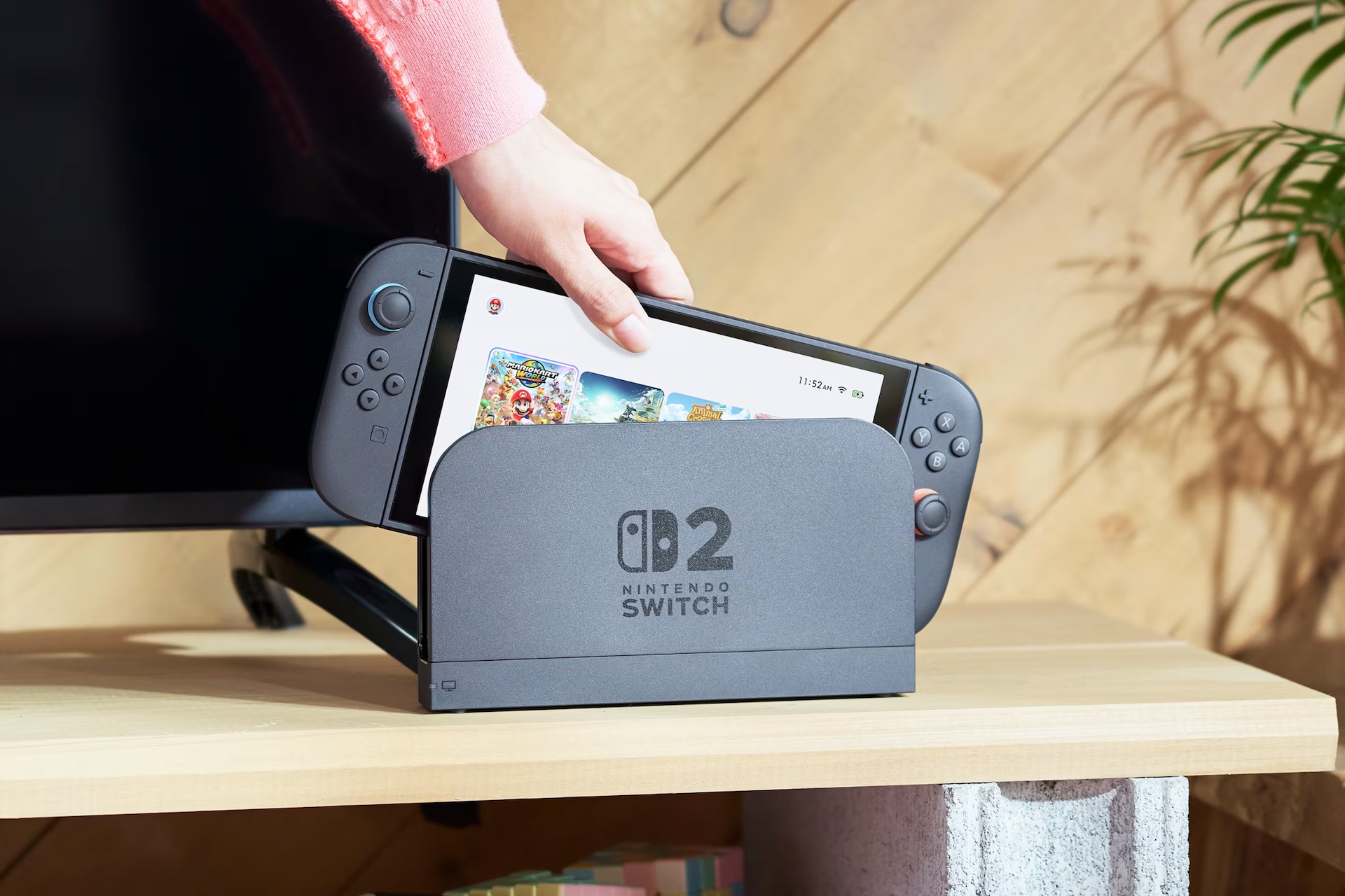 A photo of the Nintendo Switch 2 being inserted into its dock